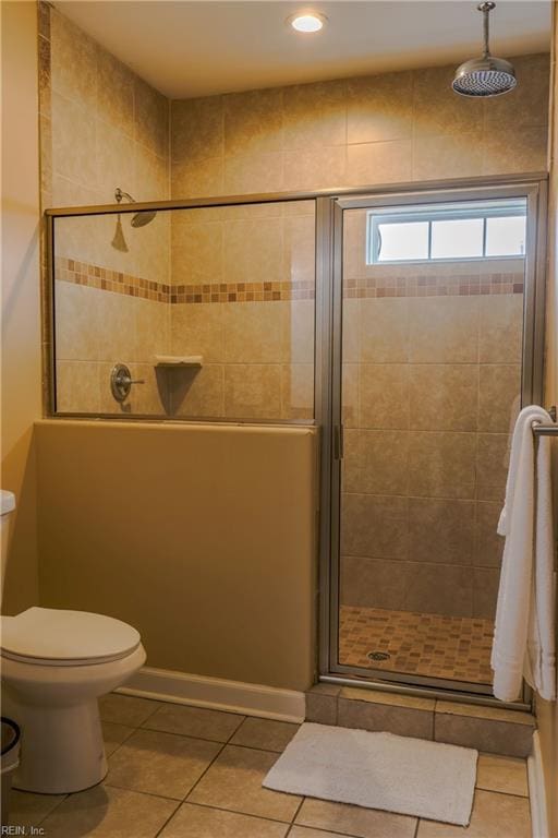 full bath with tile patterned flooring, a shower stall, toilet, and recessed lighting