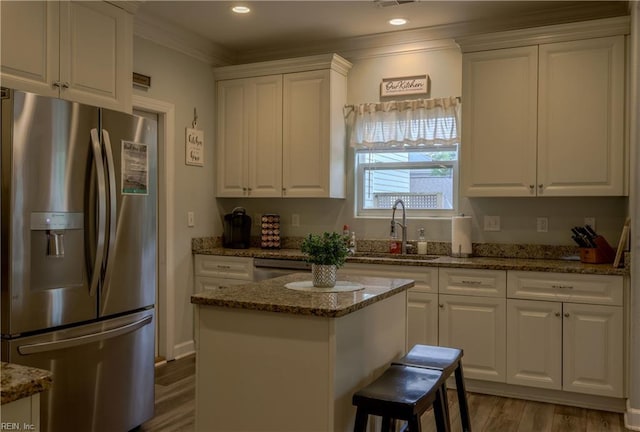 3216 Pretty Lake Ave Unit B, Norfolk, VA 23518 - kitchen with stainless steel refrigerator with ice dispenser, a sink, white cabinets, and ornamental molding