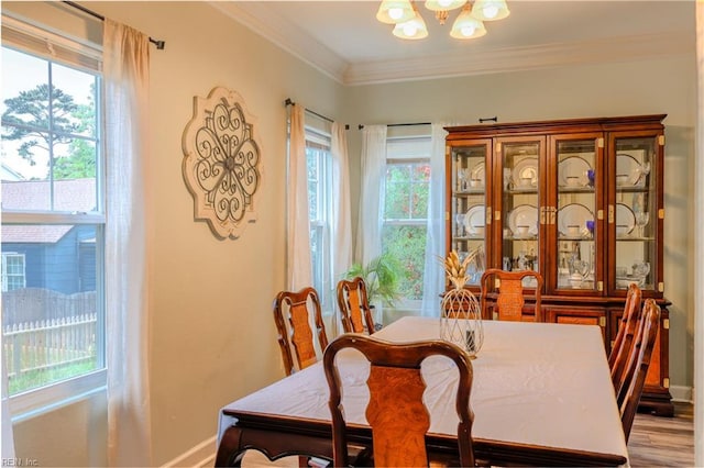 3216 Pretty Lake Ave Unit B, Norfolk, VA 23518 - dining space featuring a chandelier, plenty of natural light, baseboards, and ornamental molding