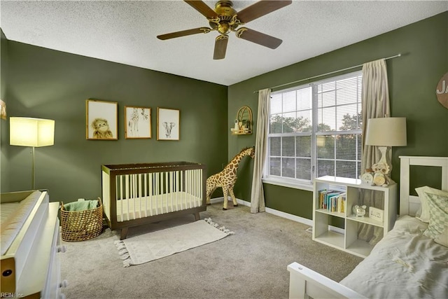 3121 Amador Dr, Virginia Beach, VA 23456 - bedroom featuring carpet floors, a textured ceiling, baseboards, a nursery area, and ceiling fan