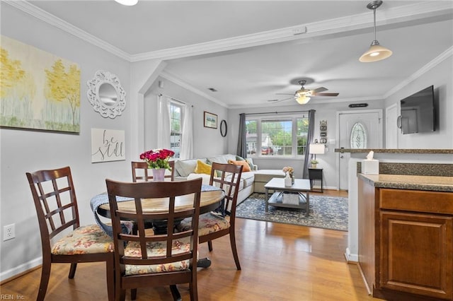 1812 Bancroft Dr, Hampton, VA 23663 - dining space featuring light wood-style flooring, crown molding, baseboards, and ceiling fan