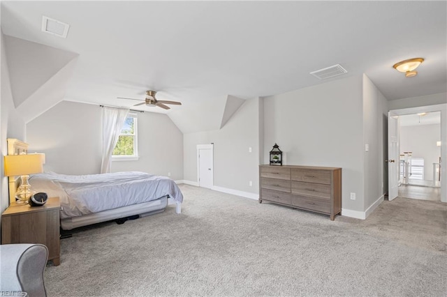 carpeted bedroom with lofted ceiling, baseboards, and ceiling fan