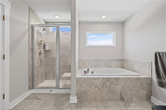 bathroom with a stall shower, a garden tub, tile patterned flooring, and baseboards