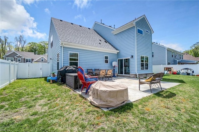 back of house with a patio and a shingled roof