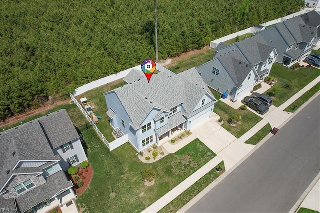 aerial perspective of suburban area with a forest