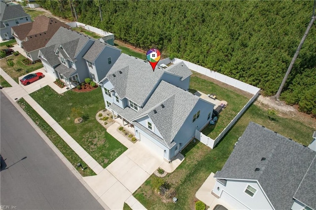 view from above of property with a heavily wooded area