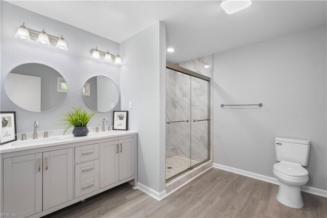 3105 Hillburn Dr, Chesapeake, VA 23323 - full bathroom featuring wood finished floors, a stall shower, toilet, and baseboards