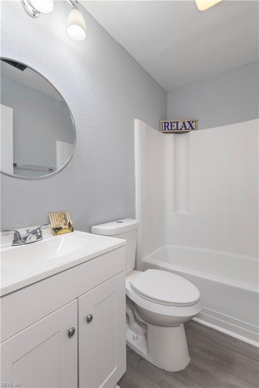 3105 Hillburn Dr, Chesapeake, VA 23323 - bathroom with wood finished floors, toilet, vanity, and washtub / shower combination