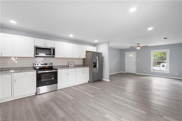 3105 Hillburn Dr, Chesapeake, VA 23323 - kitchen with stainless steel appliances, tasteful backsplash, baseboards, a ceiling fan, and white cabinets