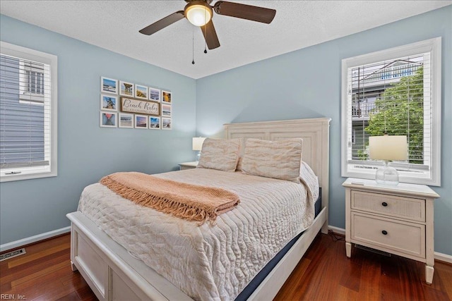 609 S Atlantic Ave, Virginia Beach, VA 23451 - bedroom featuring multiple windows, dark wood-type flooring, baseboards, and ceiling fan