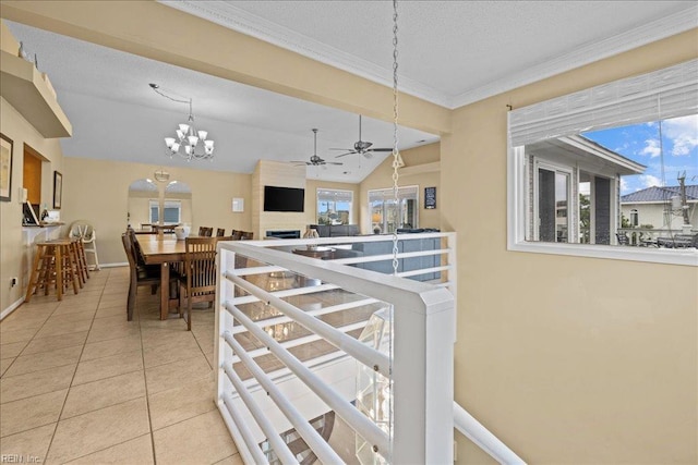 609 S Atlantic Ave, Virginia Beach, VA 23451 - corridor with vaulted ceiling, tile patterned floors, a chandelier, baseboards, and crown molding