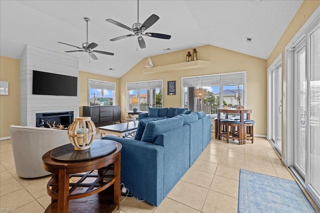 609 S Atlantic Ave, Virginia Beach, VA 23451 - living area featuring vaulted ceiling, light tile patterned floors, ceiling fan, and a large fireplace