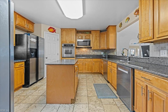 609 S Atlantic Ave, Virginia Beach, VA 23451 - kitchen featuring stainless steel appliances, a sink, a center island, and backsplash