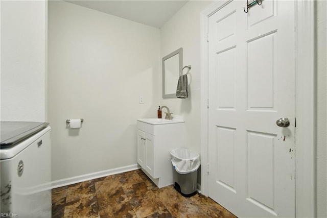 1237 Peachtree Dr, Suffolk, VA 23434 - bathroom featuring baseboards, vanity, and stone finish flooring