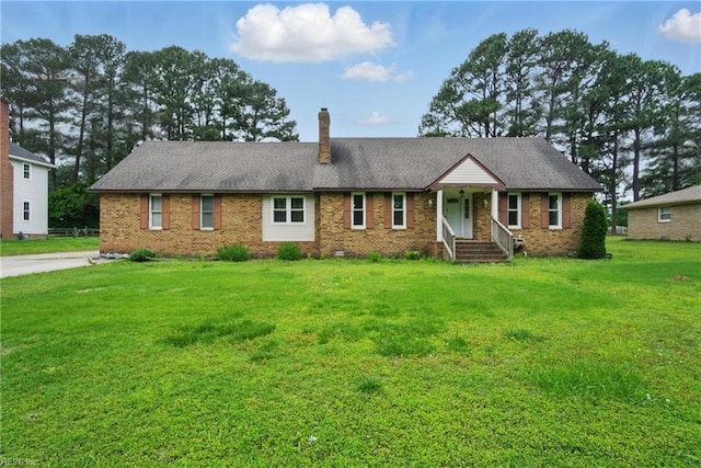 1237 Peachtree Dr, Suffolk, VA 23434 - ranch-style home with a chimney, brick siding, and a front lawn
