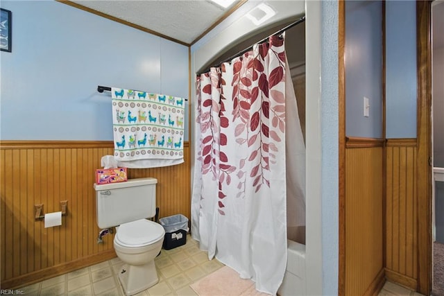 1237 Peachtree Dr, Suffolk, VA 23434 - full bathroom featuring toilet, wainscoting, wood walls, and tile patterned floors