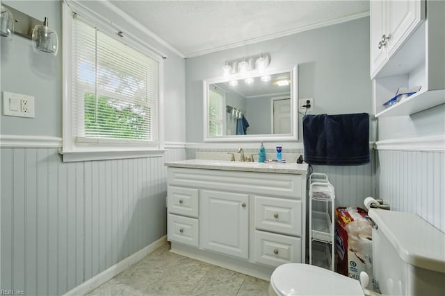 1237 Peachtree Dr, Suffolk, VA 23434 - bathroom with a wainscoted wall, toilet, ornamental molding, vanity, and a textured ceiling