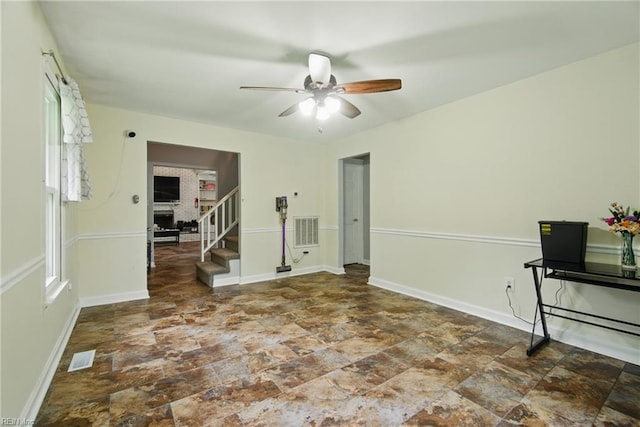 1237 Peachtree Dr, Suffolk, VA 23434 - empty room featuring ceiling fan, stairway, stone finish flooring, and baseboards