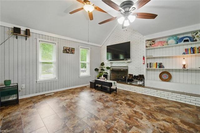 1237 Peachtree Dr, Suffolk, VA 23434 - living area with lofted ceiling, a fireplace, ceiling fan, baseboards, and wooden walls