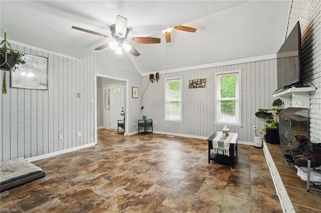1237 Peachtree Dr, Suffolk, VA 23434 - living room with a ceiling fan, baseboards, lofted ceiling, a brick fireplace, and wooden walls