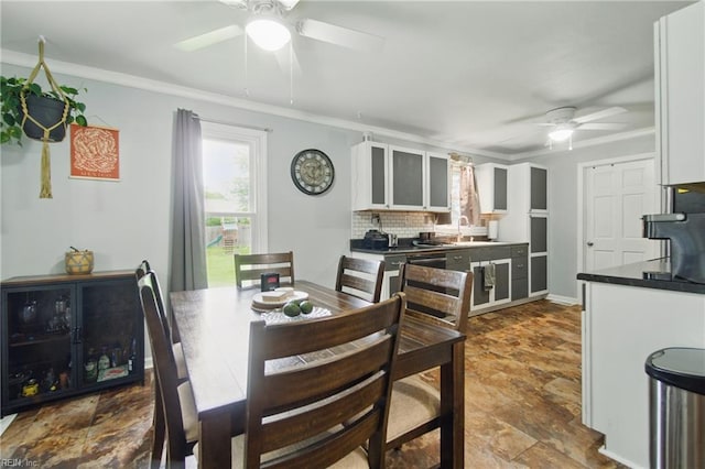 1237 Peachtree Dr, Suffolk, VA 23434 - dining area with ceiling fan, stone finish flooring, and crown molding