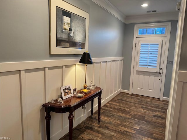 5305 Sports Club Run Unit 403, Suffolk, VA 23435 - doorway with ornamental molding, a decorative wall, dark wood-type flooring, and wainscoting