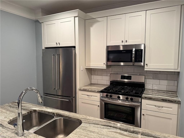 5305 Sports Club Run Unit 403, Suffolk, VA 23435 - kitchen with appliances with stainless steel finishes, a sink, tasteful backsplash, light stone countertops, and crown molding