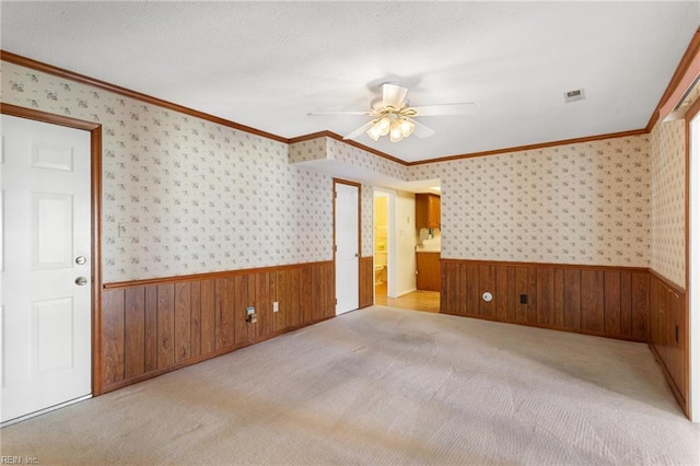 12 Critzos Ct, Hampton, VA 23669 - empty room with wainscoting, a ceiling fan, wood walls, crown molding, and wallpapered walls