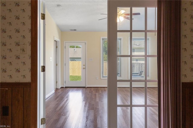 12 Critzos Ct, Hampton, VA 23669 - entrance foyer with wallpapered walls, ceiling fan, wood finished floors, and wainscoting