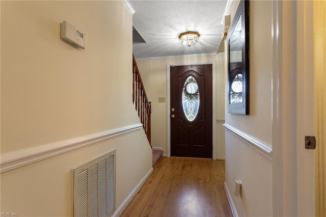 12 Critzos Ct, Hampton, VA 23669 - doorway to outside with stairway, wood finished floors, baseboards, and a textured ceiling