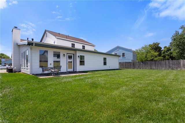 12 Critzos Ct, Hampton, VA 23669 - back of house featuring a chimney, central AC unit, and a patio