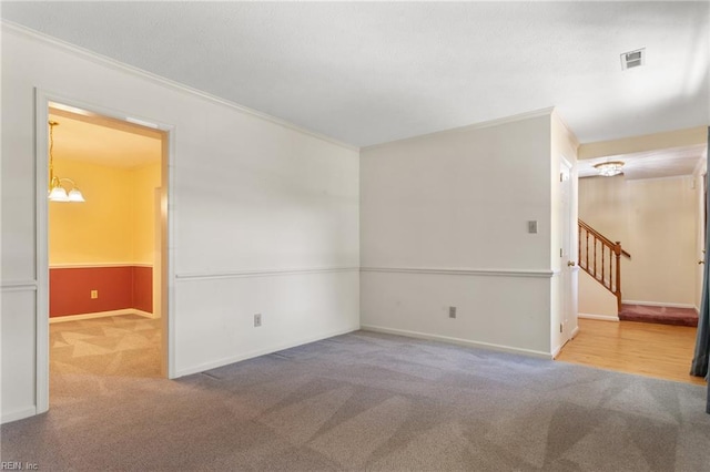 12 Critzos Ct, Hampton, VA 23669 - unfurnished room with carpet flooring, crown molding, baseboards, stairway, and a chandelier