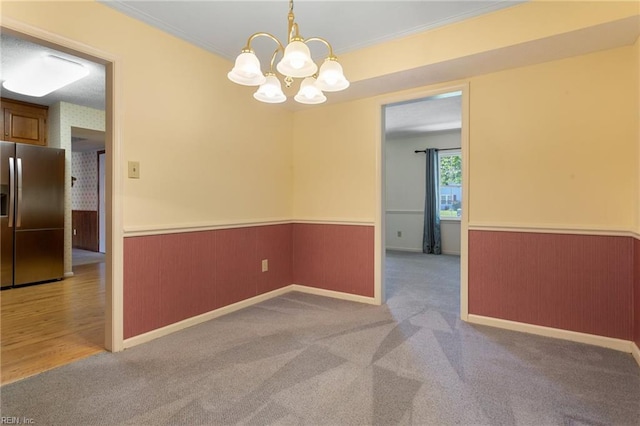 12 Critzos Ct, Hampton, VA 23669 - carpeted empty room featuring wainscoting, a chandelier, and ornamental molding