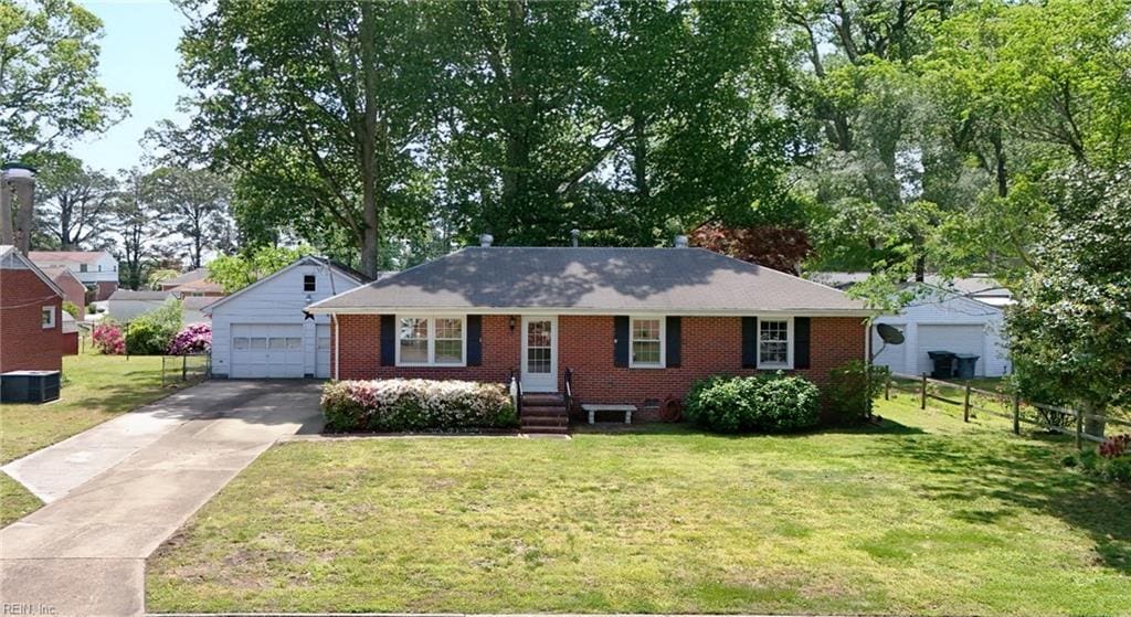 4021 Hazelwood Rd, Hampton, VA 23666 - ranch-style house with brick siding, concrete driveway, a detached garage, and entry steps