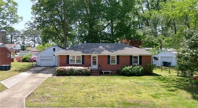 4021 Hazelwood Rd, Hampton, VA 23666 - ranch-style house with brick siding, concrete driveway, a detached garage, and entry steps