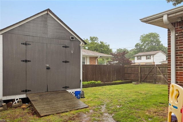 view of yard with an outbuilding and a shed