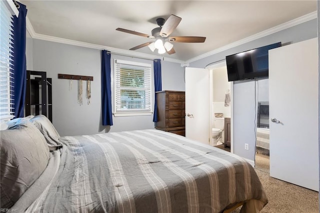 bedroom featuring ornamental molding, carpet floors, ensuite bath, and ceiling fan
