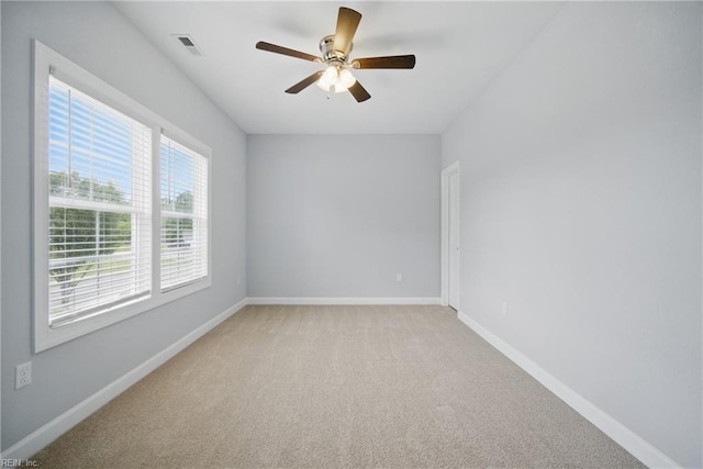 4030 Evan Cir, Suffolk, VA 23435 - spare room featuring light colored carpet, ceiling fan, and baseboards