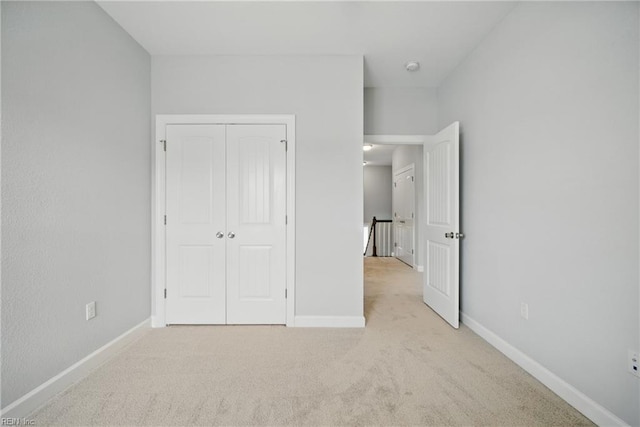 4030 Evan Cir, Suffolk, VA 23435 - unfurnished bedroom with light carpet, baseboards, and a closet