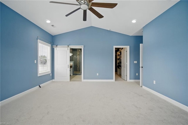 4030 Evan Cir, Suffolk, VA 23435 - unfurnished bedroom with a walk in closet, lofted ceiling, carpet floors, baseboards, and connected bathroom