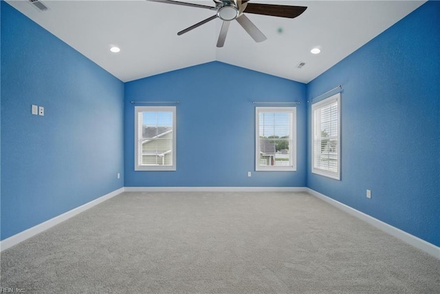 4030 Evan Cir, Suffolk, VA 23435 - carpeted empty room with ceiling fan, vaulted ceiling, plenty of natural light, and baseboards
