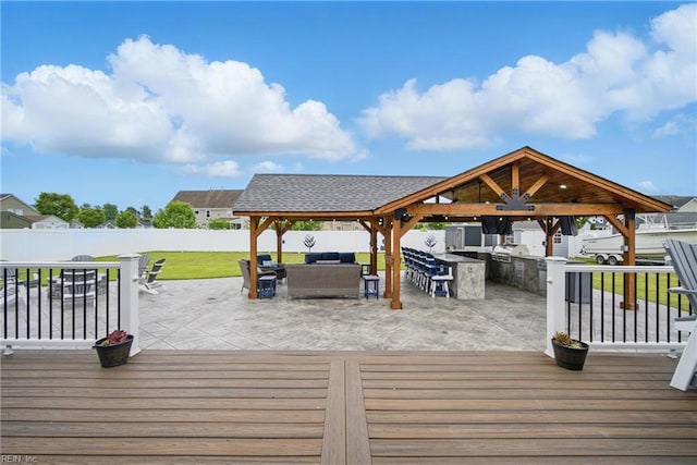4030 Evan Cir, Suffolk, VA 23435 - wooden terrace featuring a gazebo, exterior kitchen, outdoor lounge area, and a patio