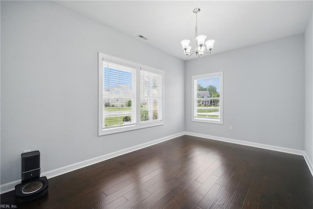 4030 Evan Cir, Suffolk, VA 23435 - unfurnished dining area with a chandelier, dark wood-type flooring, and baseboards