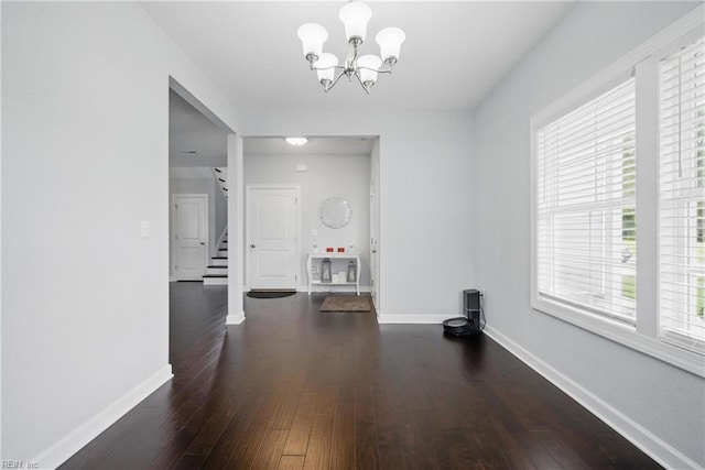4030 Evan Cir, Suffolk, VA 23435 - unfurnished dining area featuring baseboards, stairway, wood finished floors, and a chandelier
