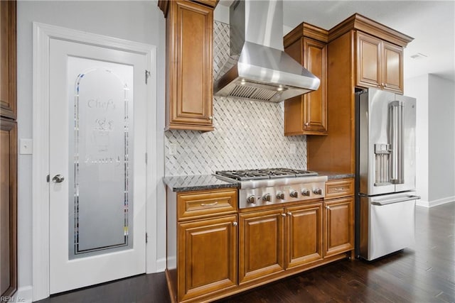 4030 Evan Cir, Suffolk, VA 23435 - kitchen featuring stainless steel appliances, wall chimney exhaust hood, dark wood-style flooring, backsplash, and brown cabinetry