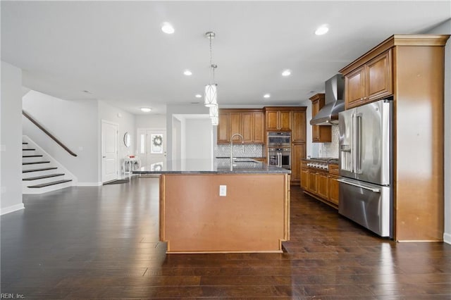 4030 Evan Cir, Suffolk, VA 23435 - kitchen featuring stainless steel appliances, wall chimney exhaust hood, brown cabinets, recessed lighting, and dark wood-type flooring