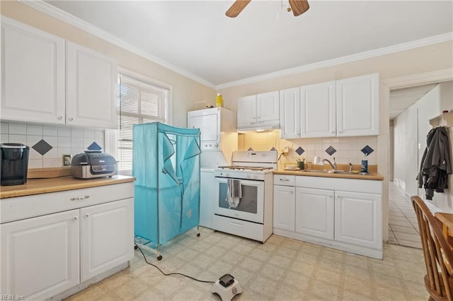 344 Maryland Ave, Portsmouth, VA 23707 - kitchen with gas range gas stove, light flooring, white cabinets, tasteful backsplash, and ornamental molding