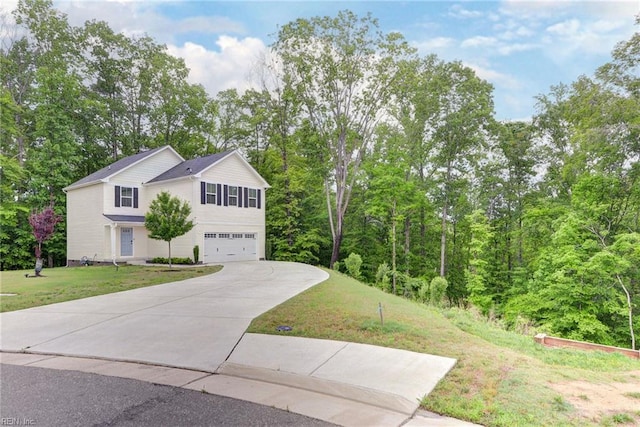 307 Lorraine Dr, Williamsburg, VA 23185 - view of front of property featuring a garage, concrete driveway, and a front yard