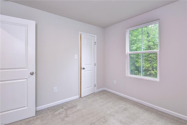 307 Lorraine Dr, Williamsburg, VA 23185 - unfurnished bedroom with carpet and baseboards