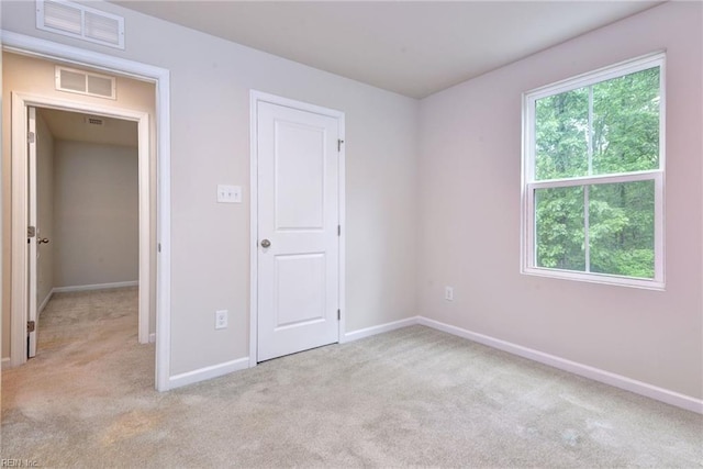 307 Lorraine Dr, Williamsburg, VA 23185 - unfurnished bedroom featuring light colored carpet and baseboards